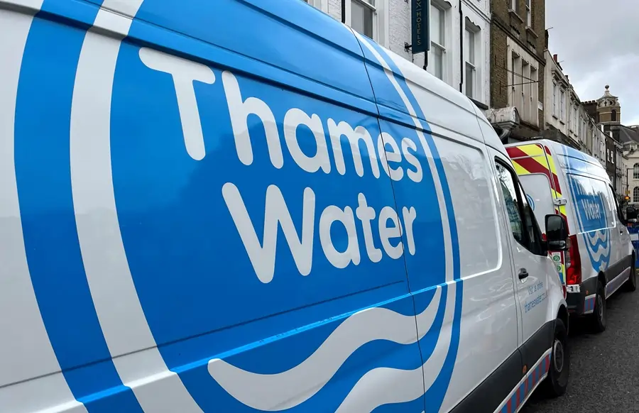 Thames Water vans parked on a London street.