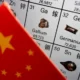 Chinese flag overlay on periodic table elements.