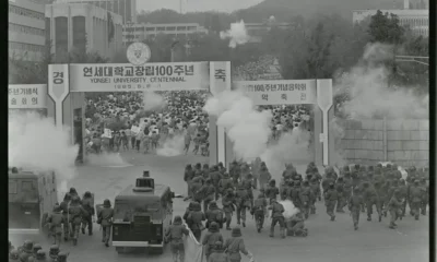 Military confronts demonstrators at Yonsei University centennial.