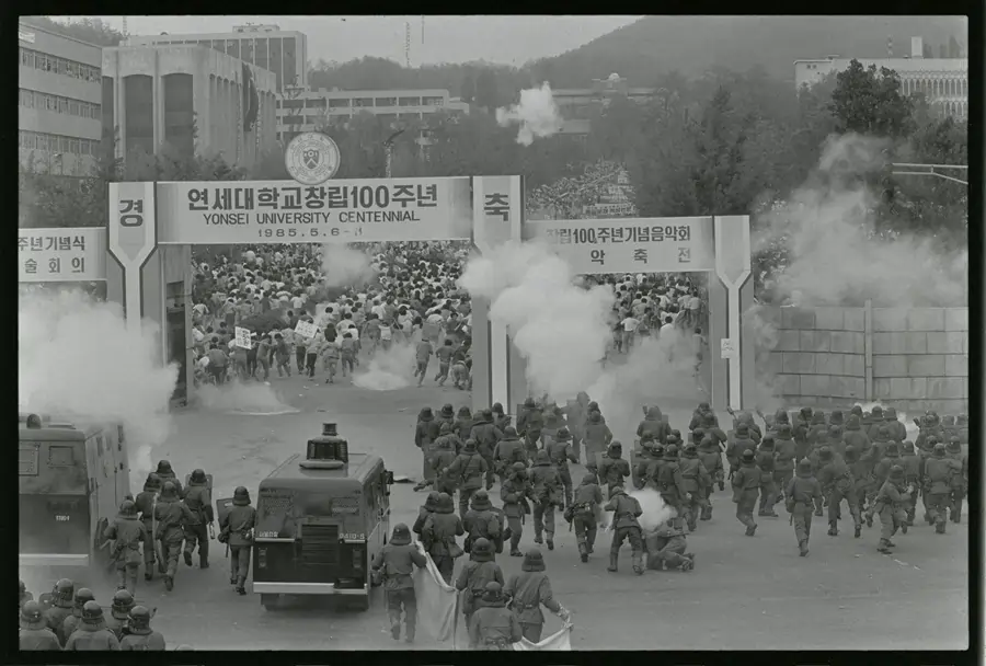 Military confronts demonstrators at Yonsei University centennial.