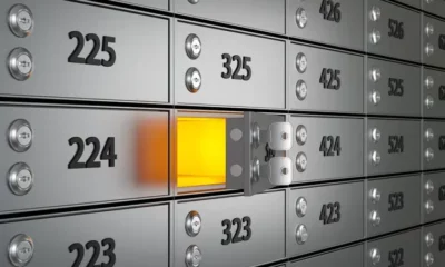 Open safety deposit box glowing inside